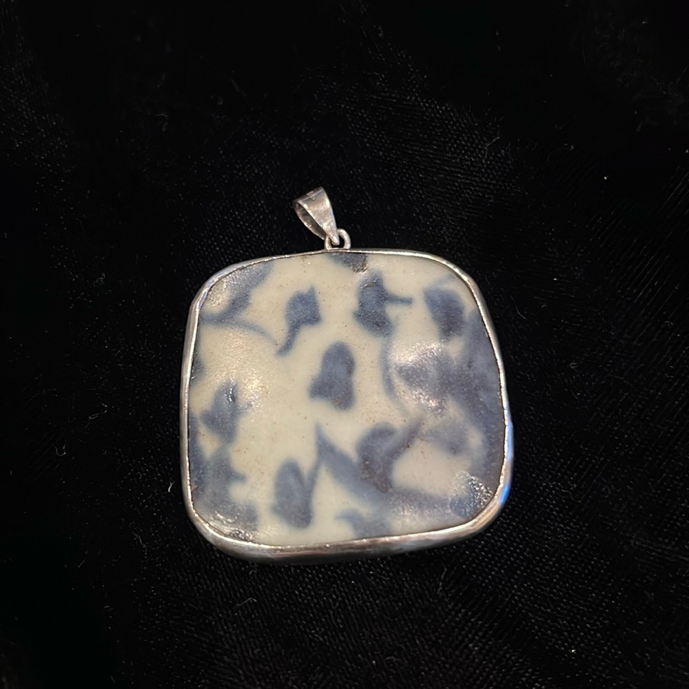 Antique Sterling pendant with antique blue and white pottery chard.